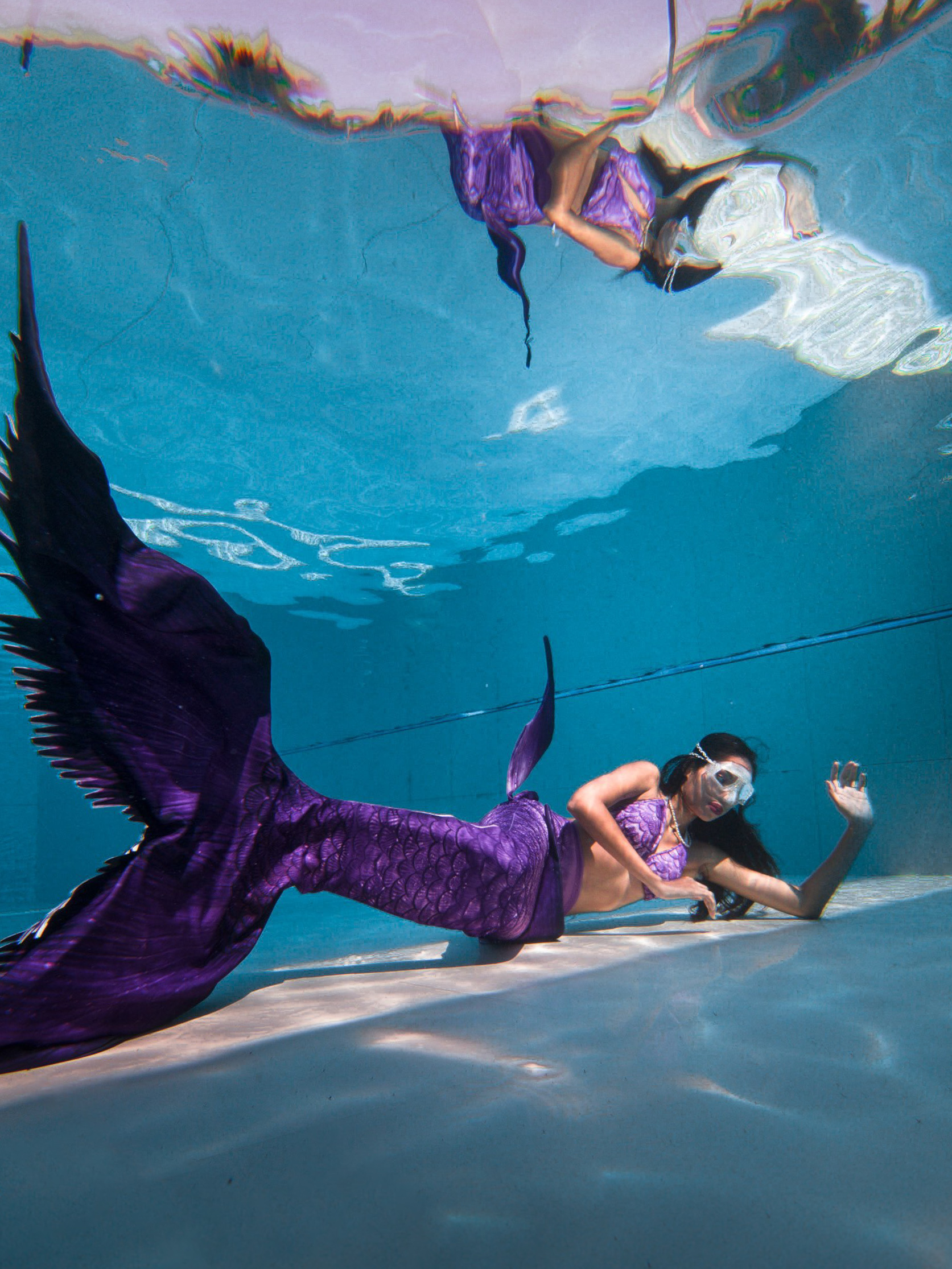 Mermaid pose underwater